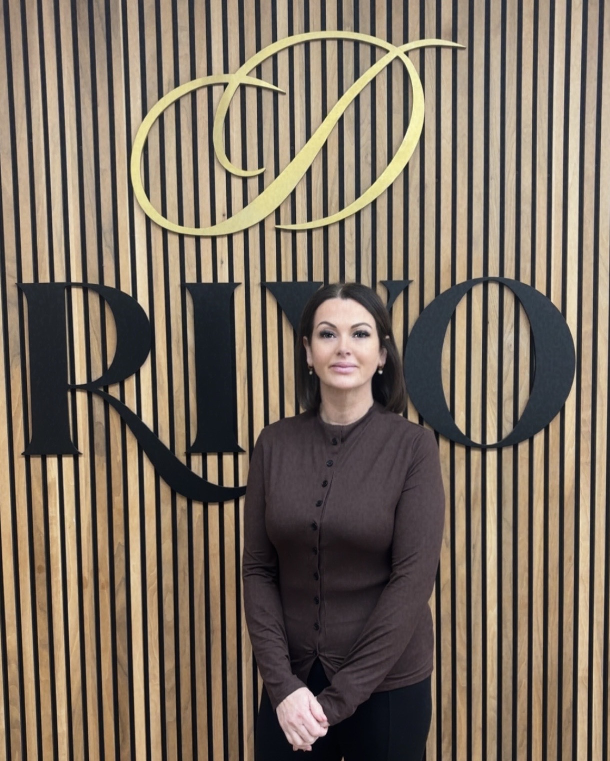 Steph Shuker, Business Manager at Riyo Dental, in staff portrait.