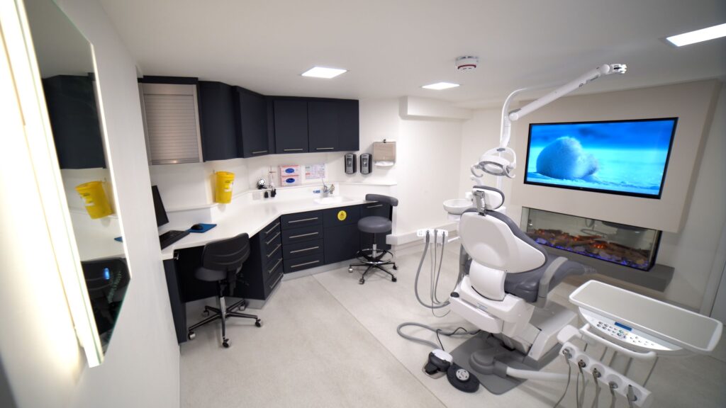 Dental practice room featuring a TV and a fireplace