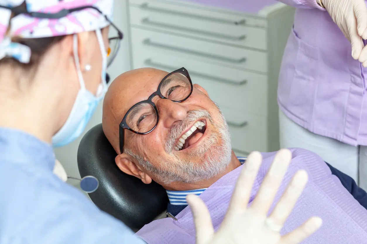 Man In Dental Chair Smiling