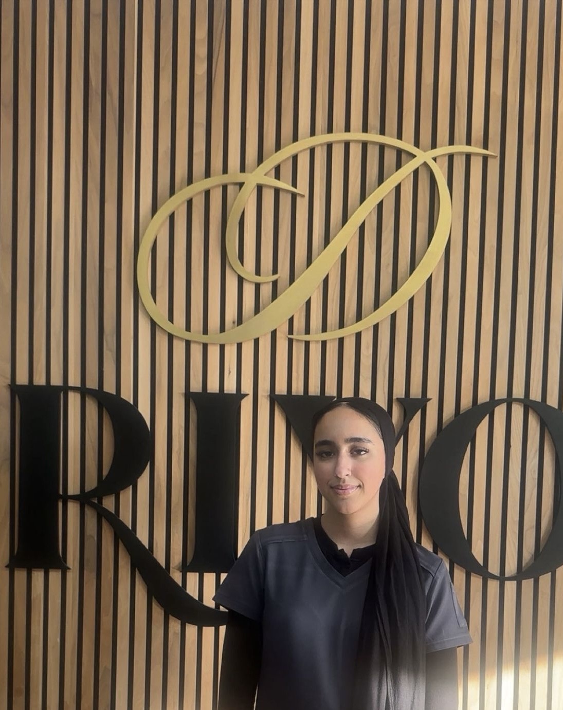 Azya Arshad, Trainee Dental Nurse at Riyo Dental, in staff portrait.